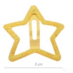Gold glitter star-shaped hair clip with a central metal clasp, about 5 cm wide, used to hold hair in place.